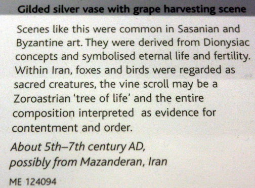 Gilded silver vase with grape harvesting scene.
